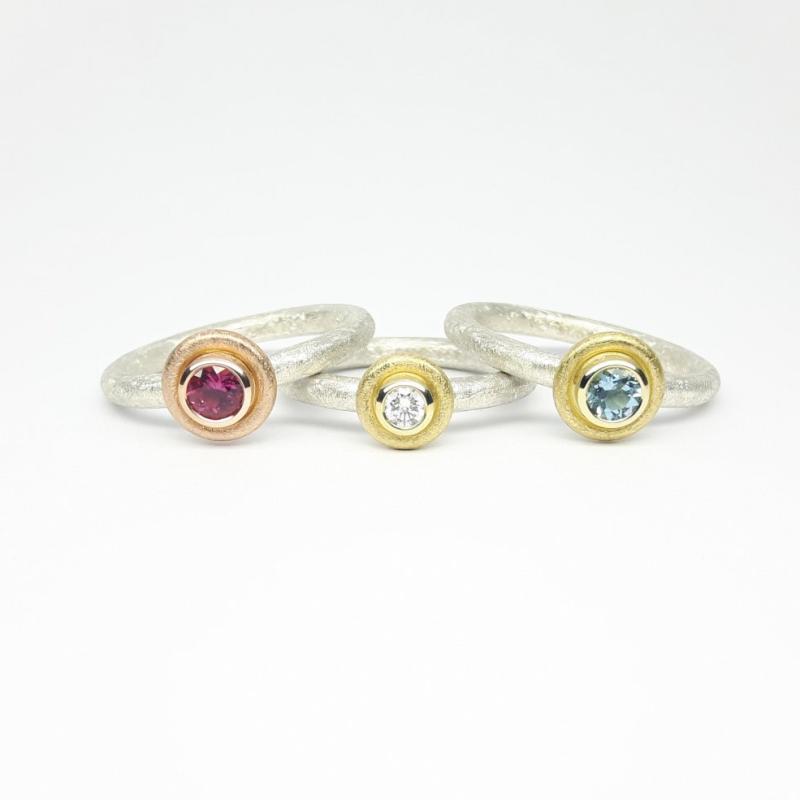 Bague en argent, or jaune 18kt et diamant 0,10ct.